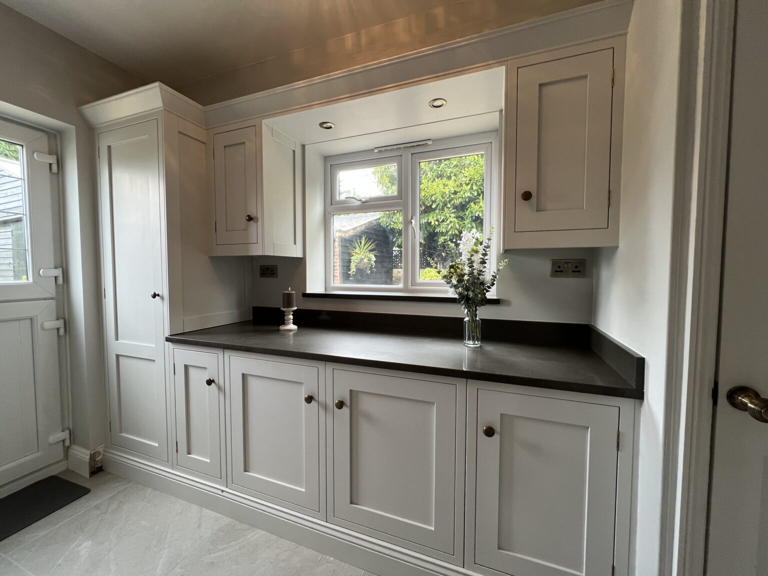 Hand-painted tulipwood cabinetry in French Grey Pale bespoke kitchen in Sible Hedingham