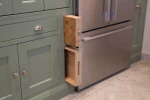 Made to measure kitchens by Regent St James Kitchens showing cleverly fitted drawers into bespoke kitchen unit