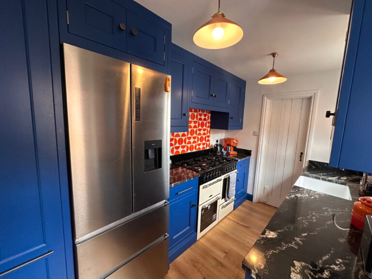 Long Melford Handmade Kitchen by Regent St James 6: Blue fitted kitchen with stainless steel fridge