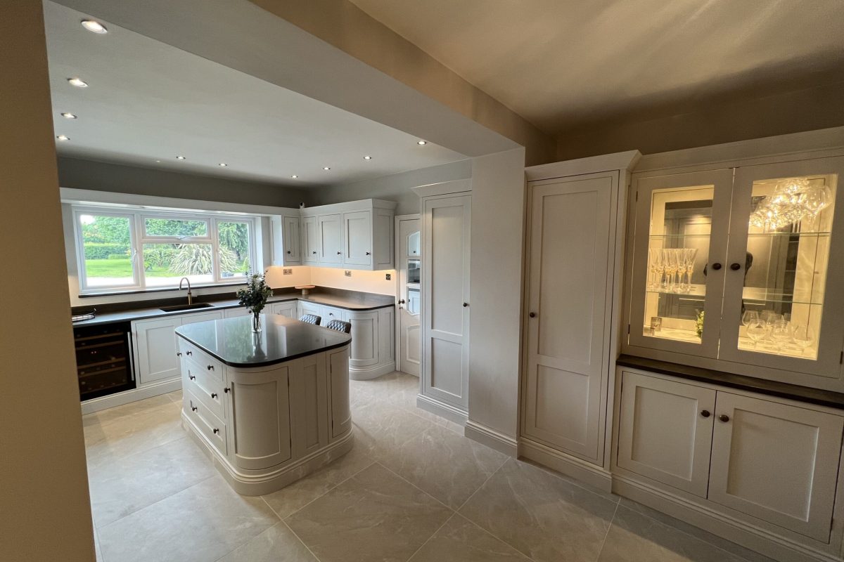 Bespoke kitchen in Sible Hedingham featuring curved island and light-filled open-plan layout
