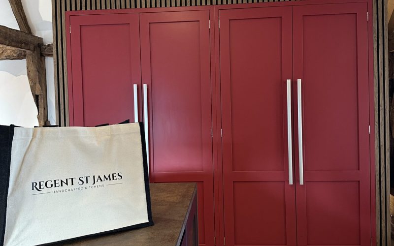 Bespoke kitchen in Thaxted featuring Paen Black and Rectory Red cabinetry within a barn conversion home.