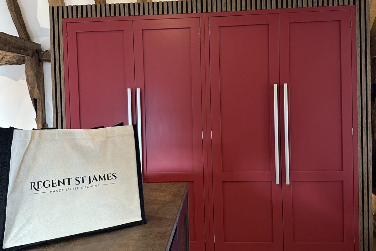 Bespoke kitchen in Thaxted featuring Paen Black and Rectory Red cabinetry within a barn conversion home.